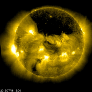 Illustration for article titled NASA spots a massive hole near the Sun's north pole